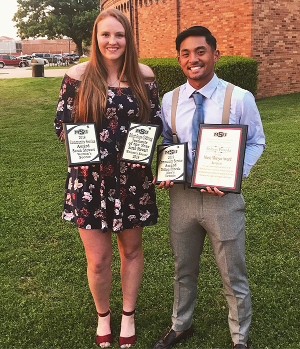 Sarah Stewart and Dillon Pineda with their community service awards.