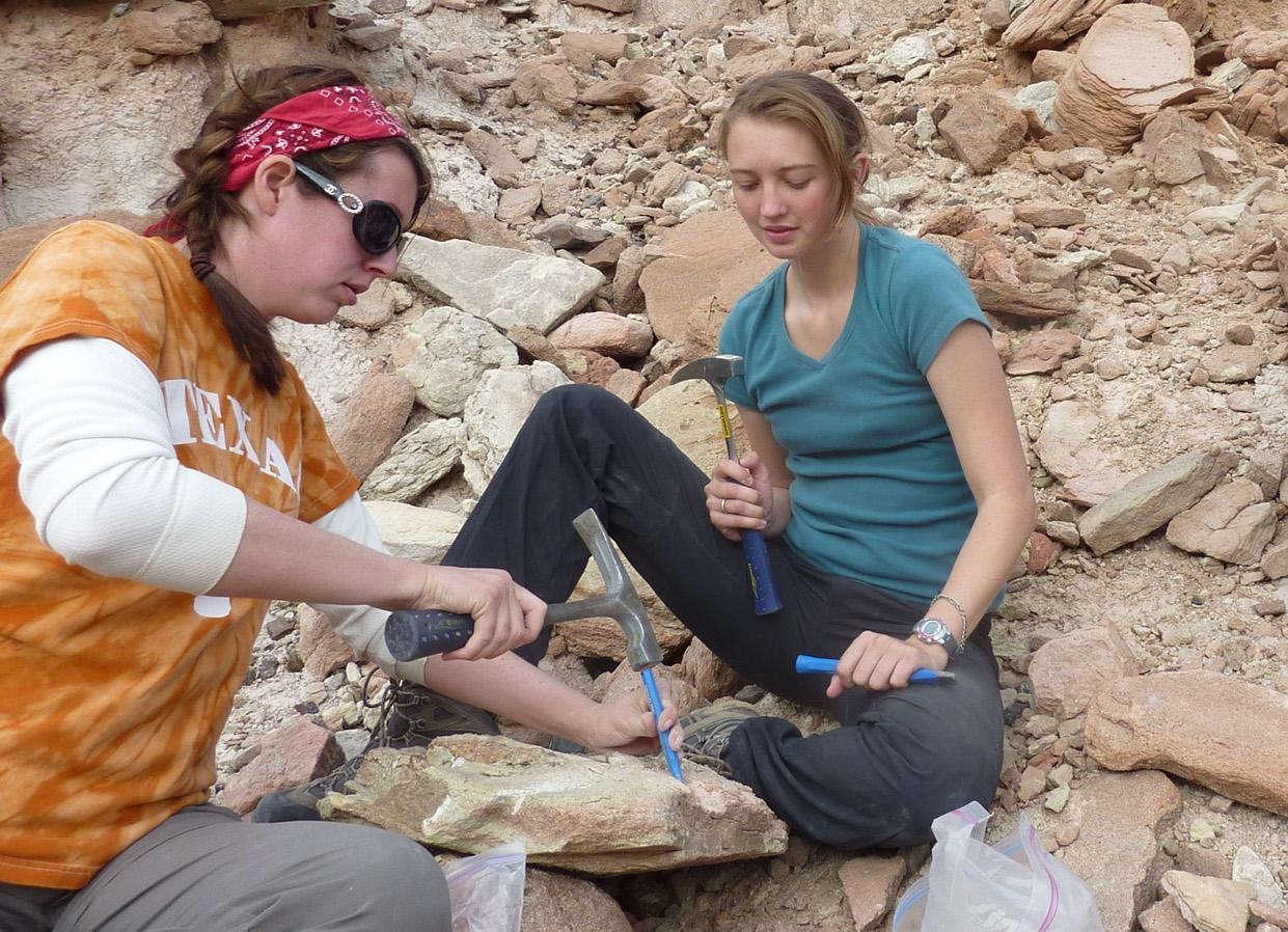 Michelle Stocker and Rachel Wallace seen excavating the caiman fossil in 2011.