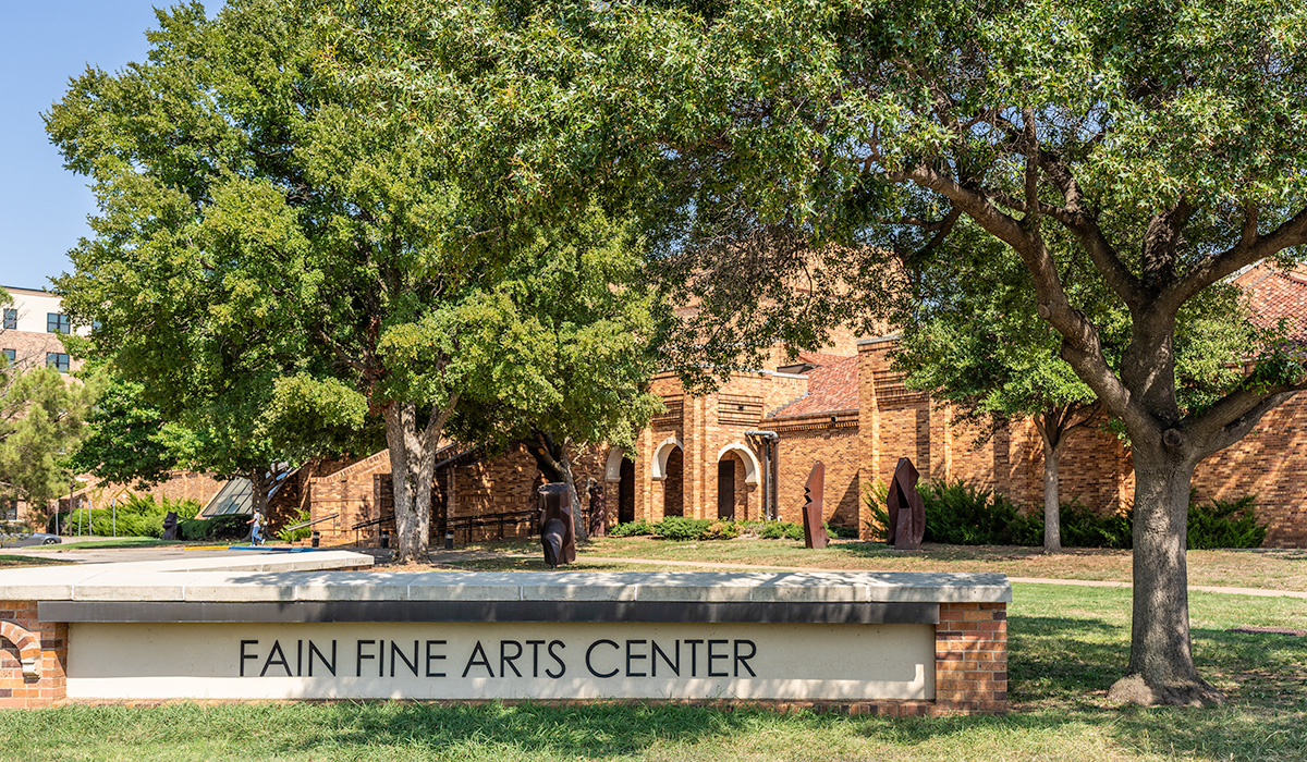 Fain Fine Arts Center from outside with daylight coming in the horizon