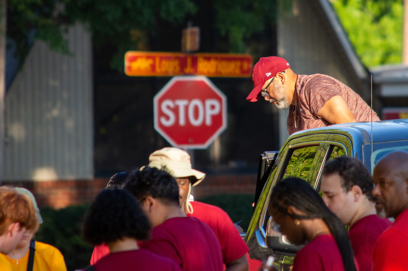 Mustangs Move-In group works near stop sign