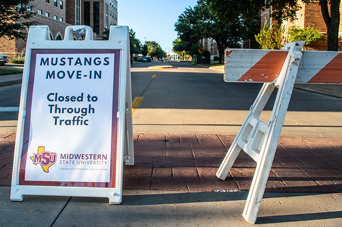 Mustangs Move In sign  Close To Traffic