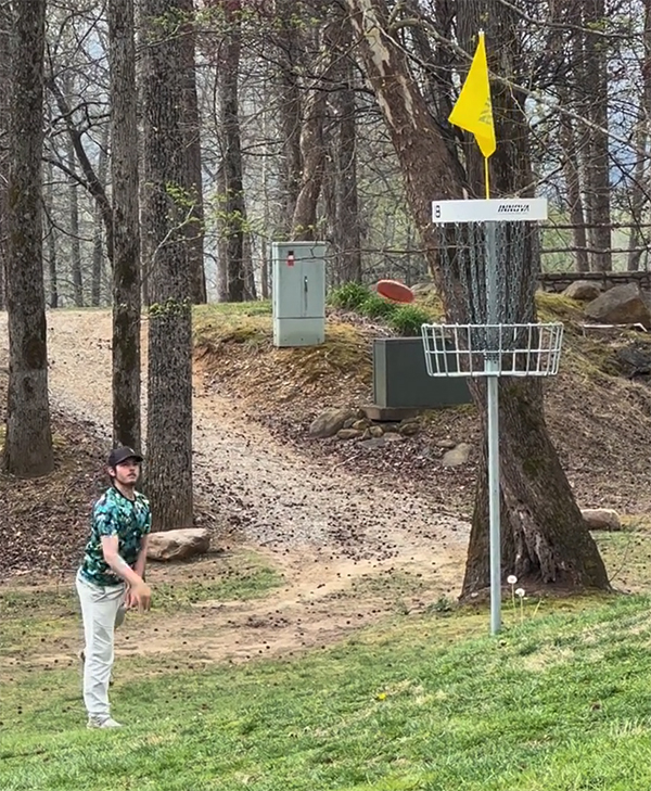 MSU disc golf makes a putt on an elevated basket in Marion, N.C.