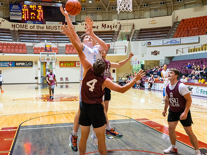 An SAFB player drives the lane to put up a shot