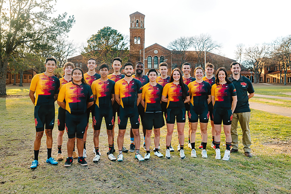 Cycling team from Spring 2023 poses outside for photo
