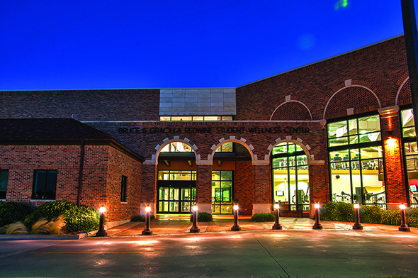 Wellnes Center view at night showing the windows of the building and front doors