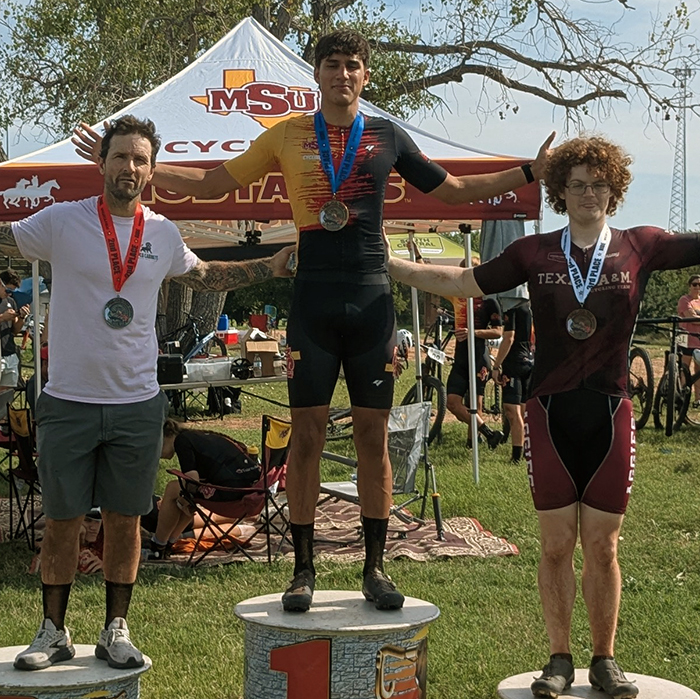 Tim Kelton Memorial award winners smile on the stand