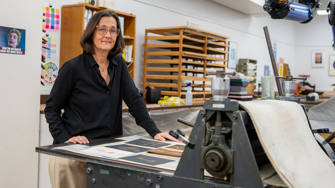 Catherine Prose with her art in the workroom