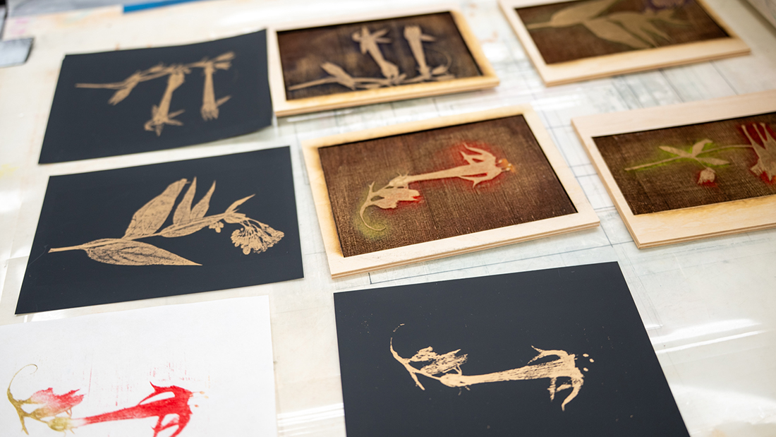 display on table with several of the art pieces by Cat Prosse