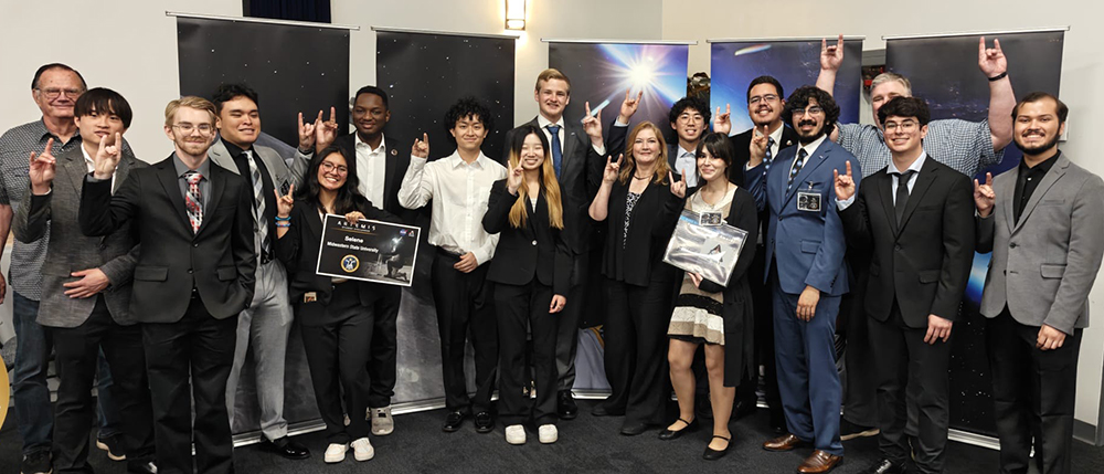 Ethan Saenz with large group at American Airlines