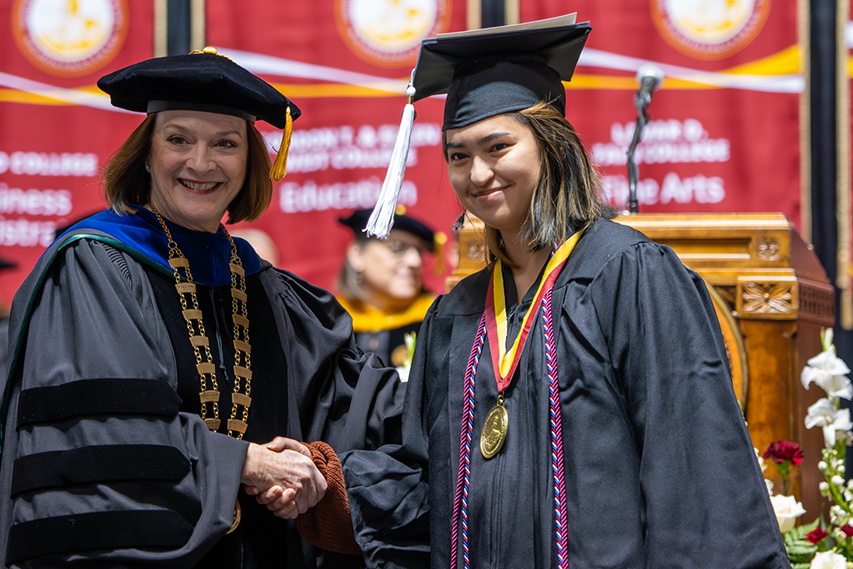 Maria Estela Gandy receives her President's Medal for Excellence