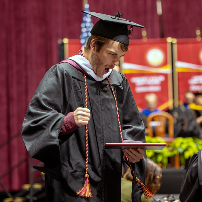Graduate shows emotion after getting his degree 