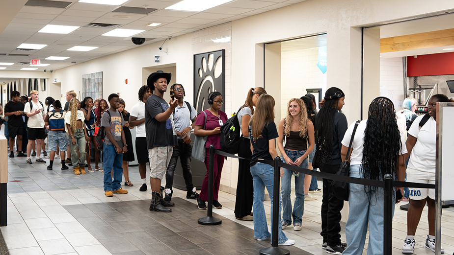 Students lined up to get lunch at the food court inside Clark Student Center