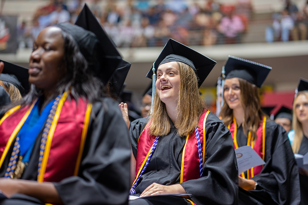 Graduation photo showing grads anticipating being called to stage