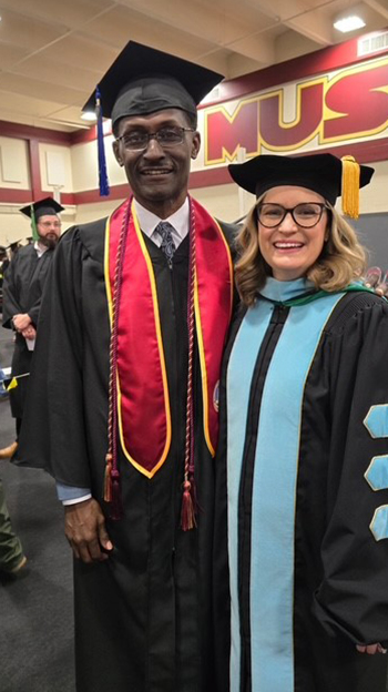 Reginald Jones, after graduation, with Dr. Jennifer Anderson from Gunn College