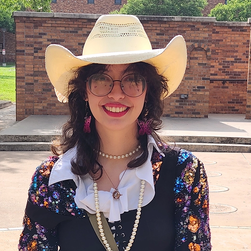 Sabrina standing outside Fain Fine Arts building