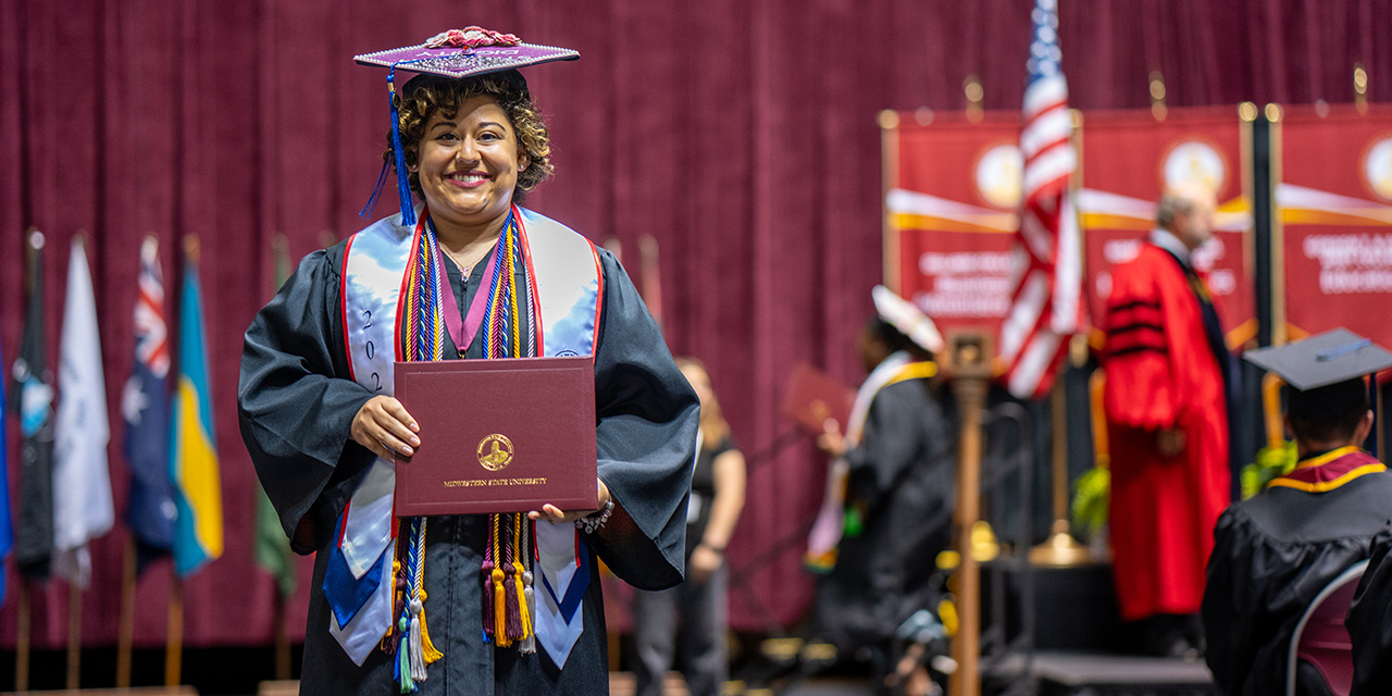 Wendy Romero receives her diploma from Midwestern State University