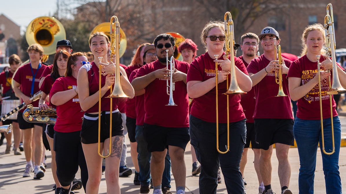 Band plays as they march at the soccer team parade