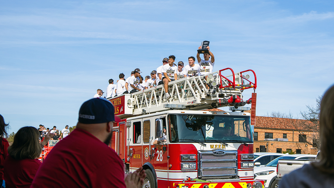 Soccer team on a fire truck at parade