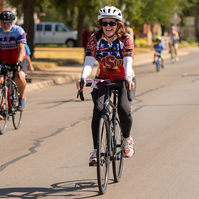 President Stacia Haynie rides her bike in the HHH Head Start event on Aug. 23, 2026