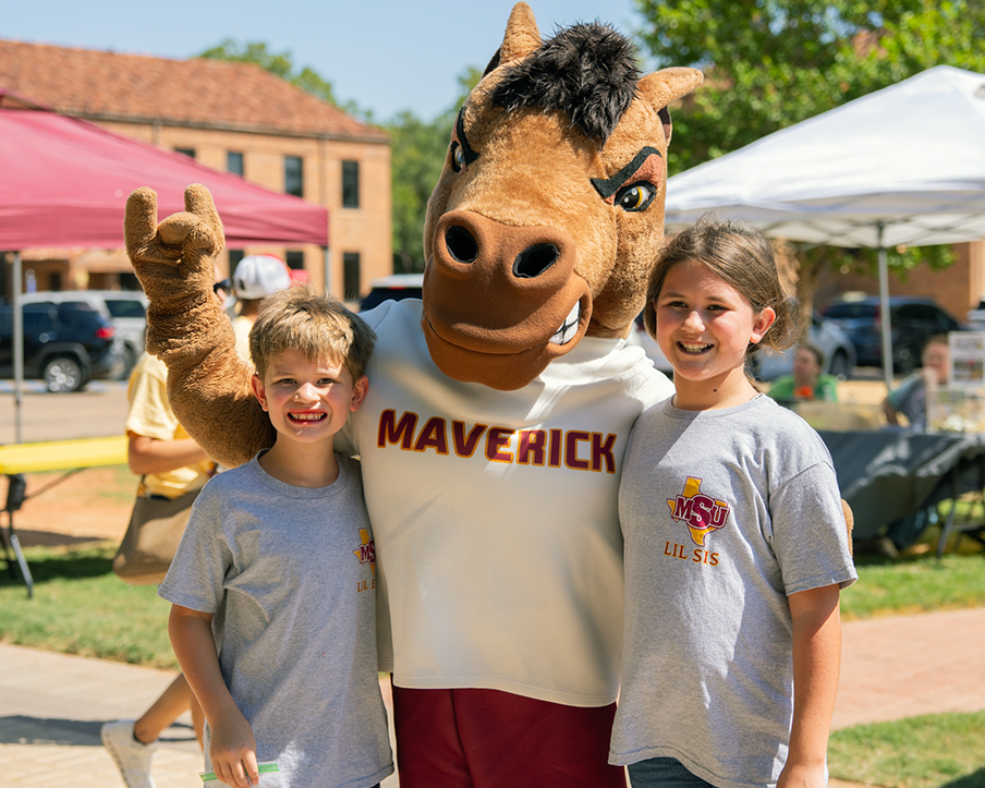 Kids have fun with Maverick, the MSU Texas mascot, at Family Day