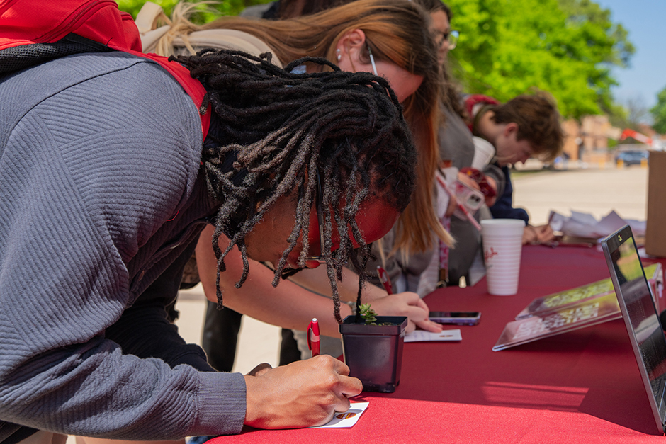 Donors sign in at the table on Giving Day