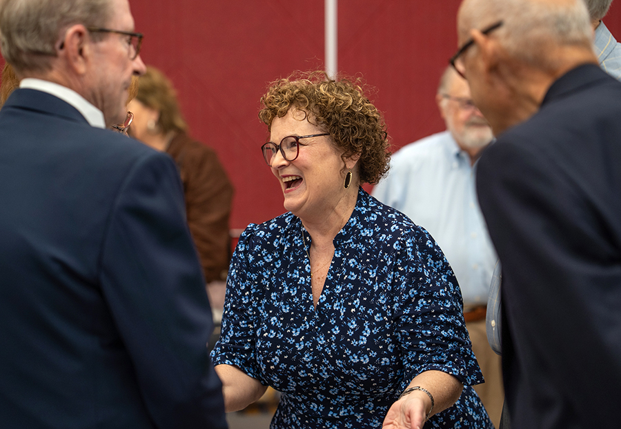 Debbie Barrow laughs as she converses at the celebration