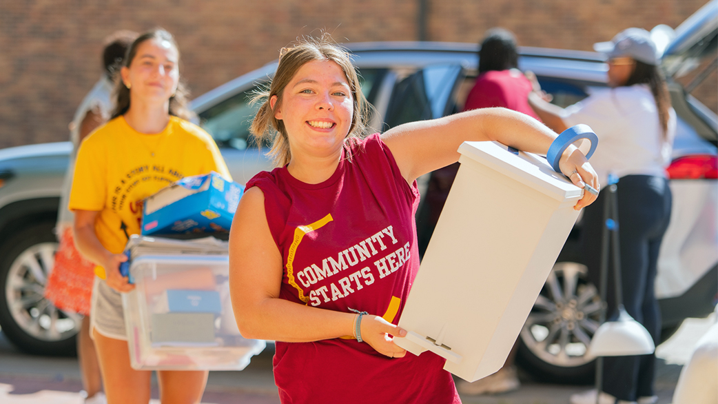 Volunteers working outside on Mustangs Move-In Day