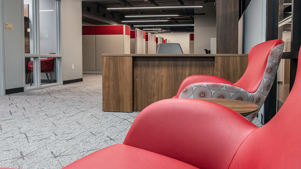 A lobby area with maroon chairs at Bridwell Actitivies Center