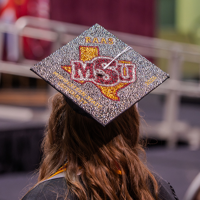 Grad shows off decorated cap at Spring 2026 Commencement