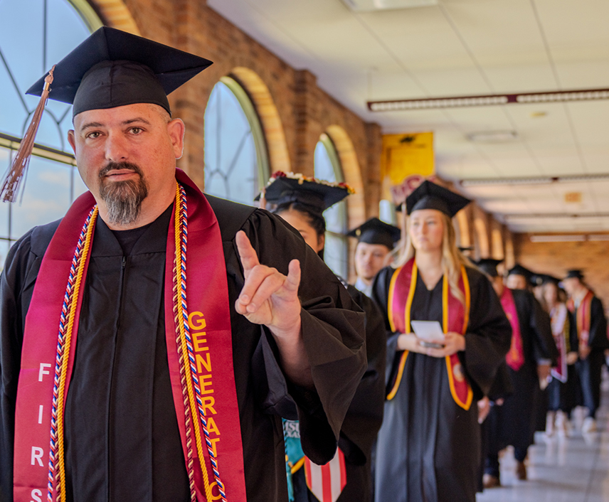 Graduates in the hallway anticipating their graduation ceremony