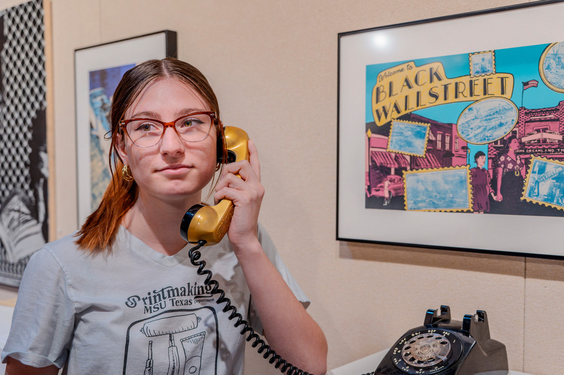 Hailey Padilha with her exhibit at the Harvey Art Gallery