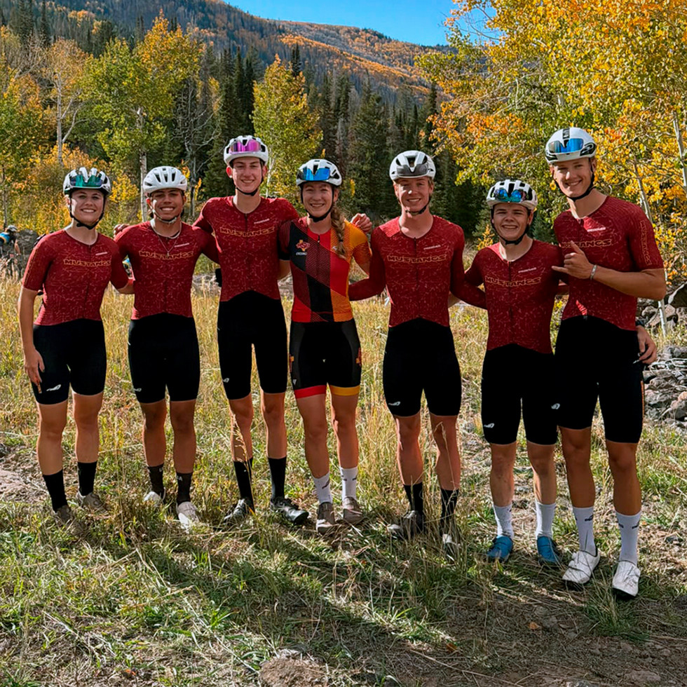 MSU Cycling team poses for photo at the Mountain Bike Nationals with mountain behind in the background
