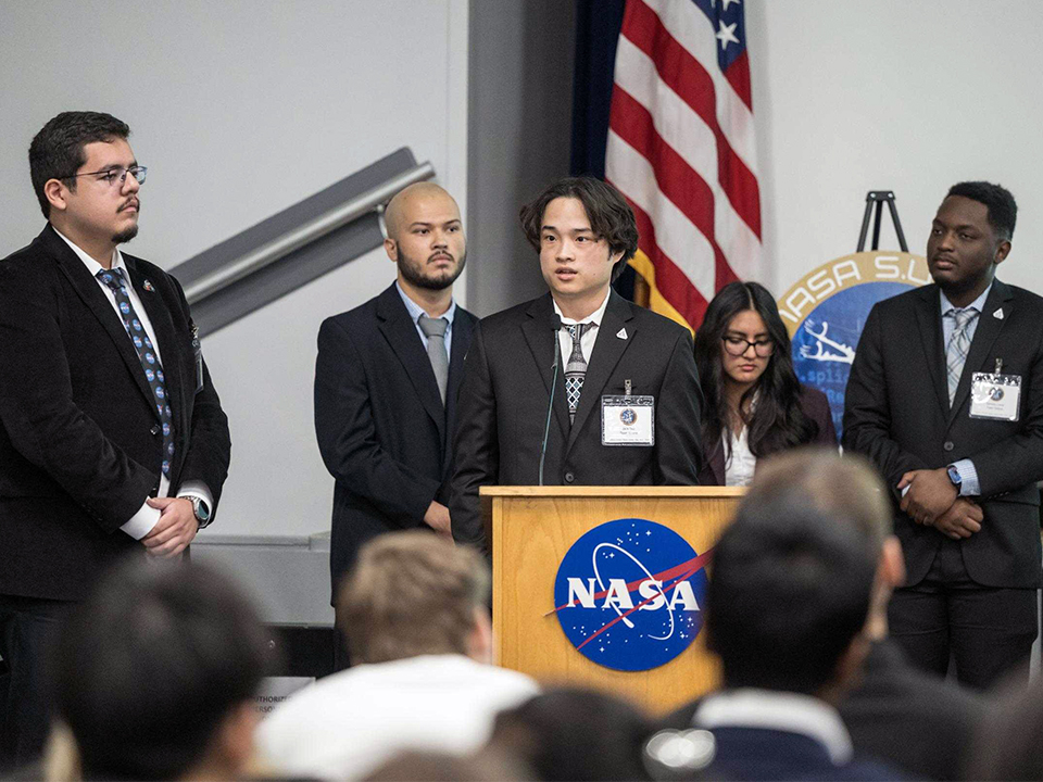 Small group of Team Selene discuss their project