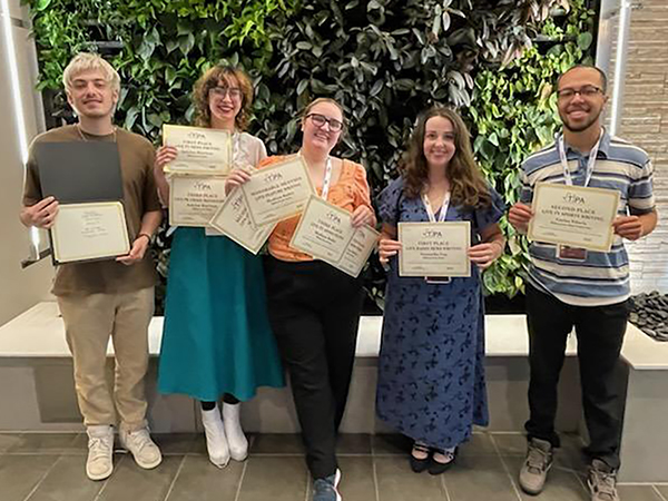 Five MSU Texas students hold up their certificates from the TIPA Awards